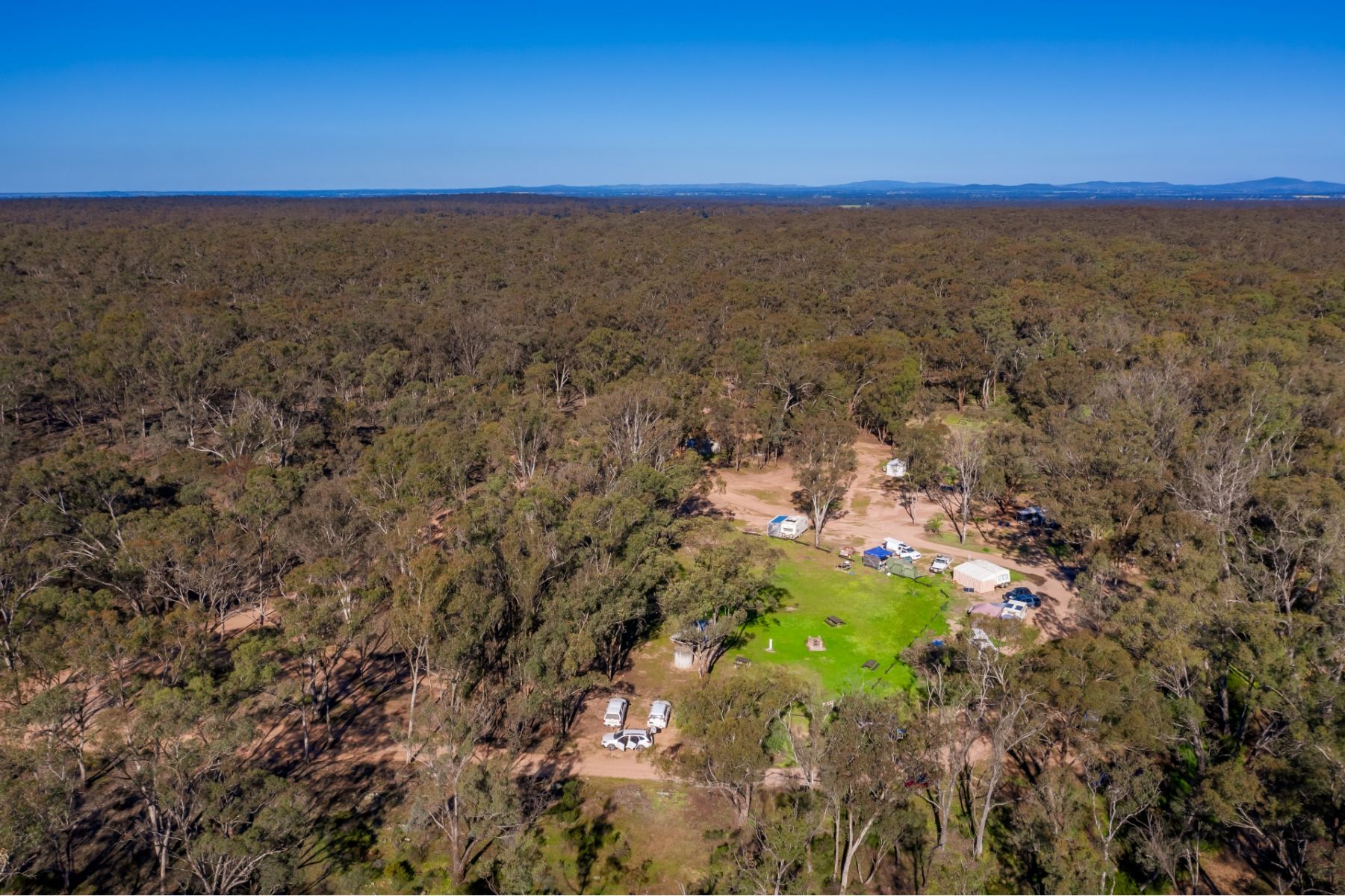 Aerial view of the campground and hills in the distance