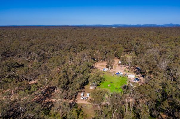 Aerial view of the campground and hills in the distance