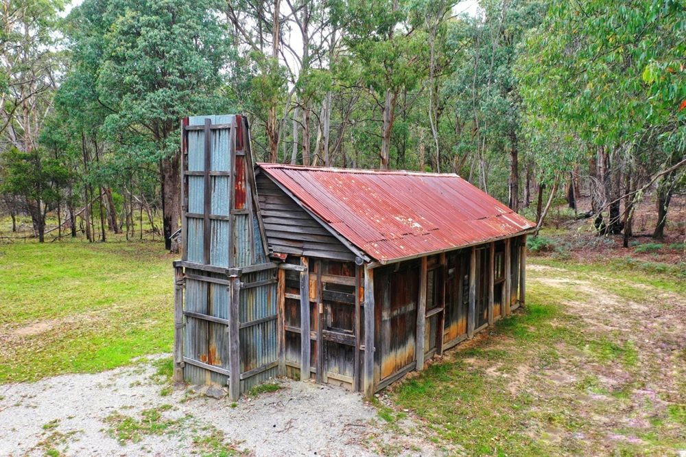 An historic hut in the forest.   