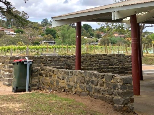Picnic facilities including red top rubbish bin