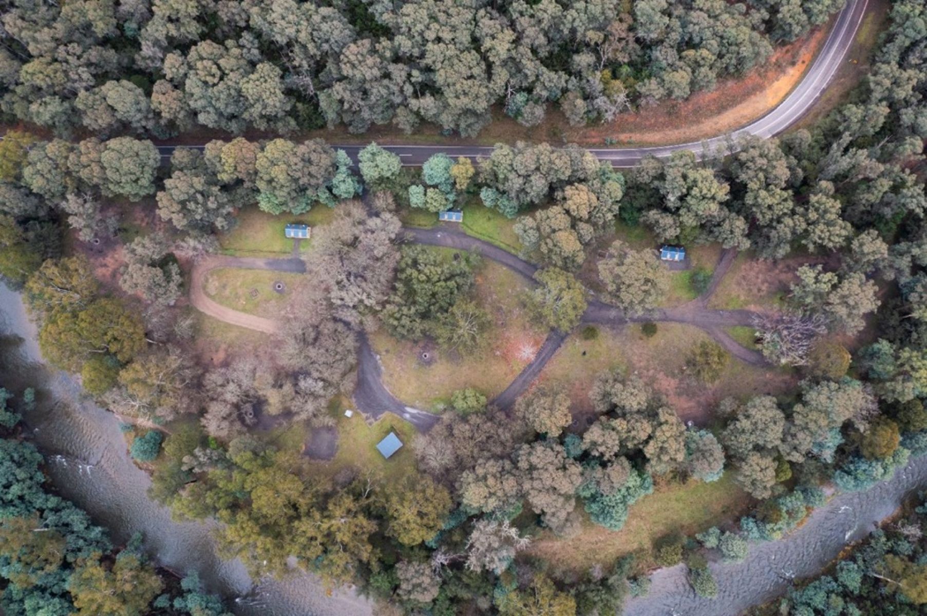 A birds-eye view of a campground in the forest. 