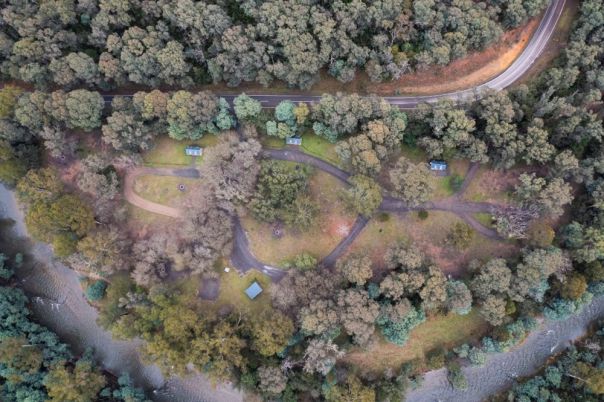A birds-eye view of a campground in the forest. 