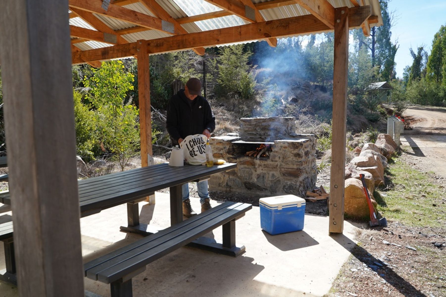 A picnic shelter surrounded by forest