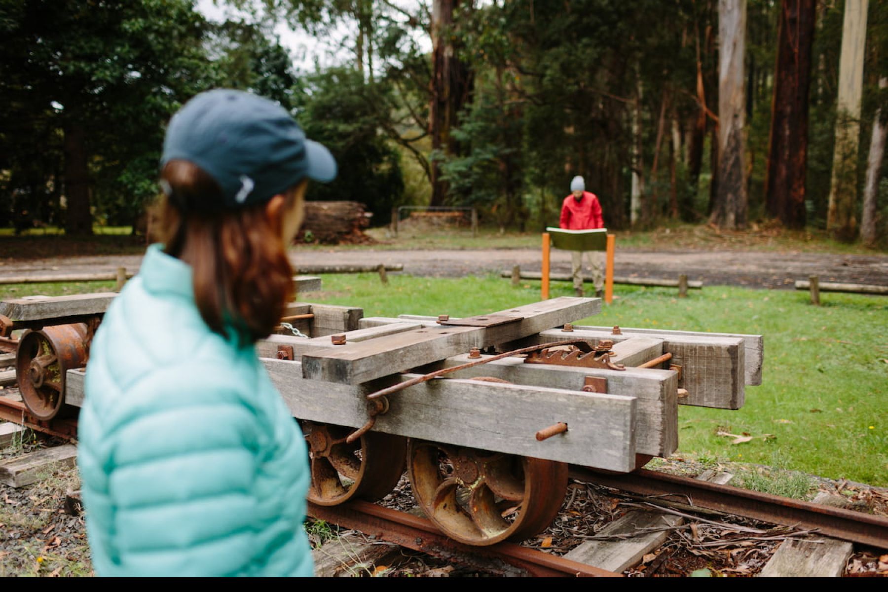 People looking at old timber industry equipment