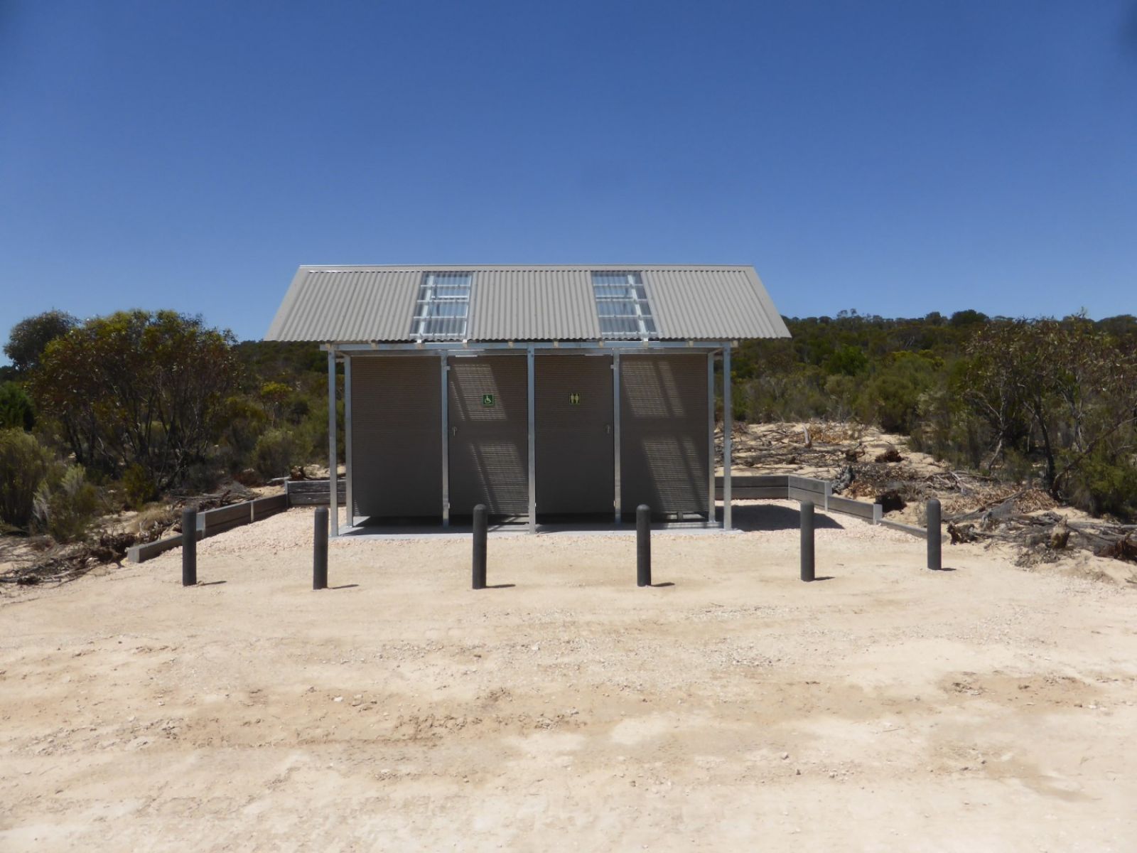 A metal toilet block in a campground.