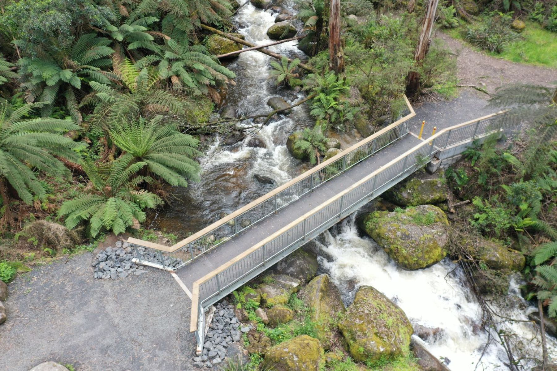 Aerial view of a footbridge over a river crossing