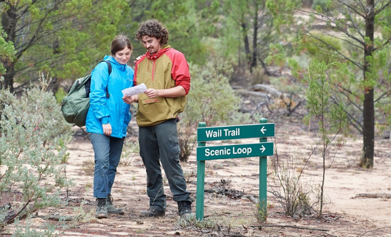 Two people looking at a map along the Beeripmo Walk  