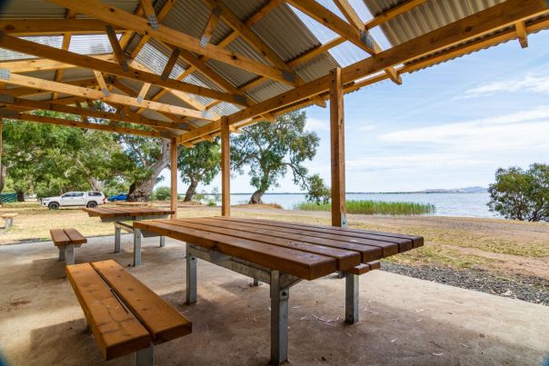 Two sets of tables and chairs at the undercover picnic shelter